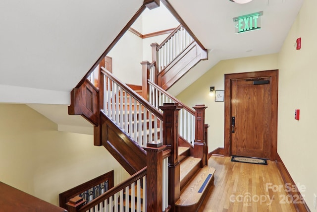 203 6th Ave W Unit 2A, Hendersonville, NC 28739 - foyer with light wood finished floors and stairs