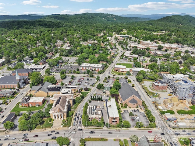 203 6th Ave W Unit 2A, Hendersonville, NC 28739 - aerial view of property and surrounding area with mountains and a forest
