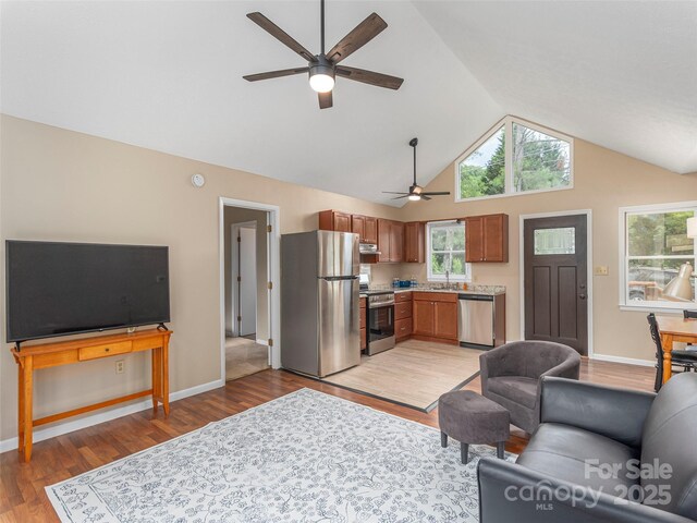 286 Keith Dr, Canton, NC 28716 - living area featuring ceiling fan, light wood-style floors, and high vaulted ceiling