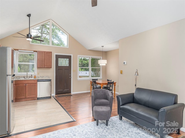 286 Keith Dr, Canton, NC 28716 - living area featuring ceiling fan, light wood finished floors, and high vaulted ceiling