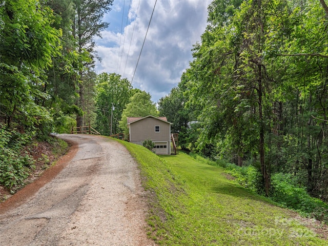 286 Keith Dr, Canton, NC 28716 - view of front of property featuring driveway, a front lawn, a forest view, a garage, and a chimney