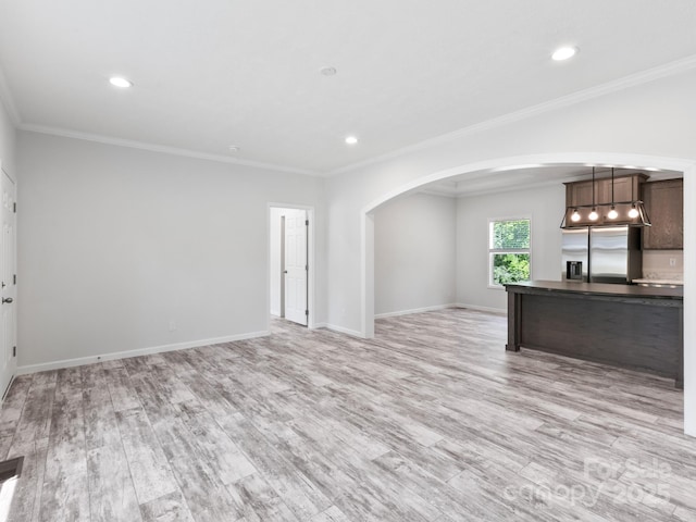 208 Walnut Branch Rd, Weaverville, NC 28787 - kitchen with stainless steel fridge with ice dispenser, arched walkways, dark countertops, light wood finished floors, and open floor plan