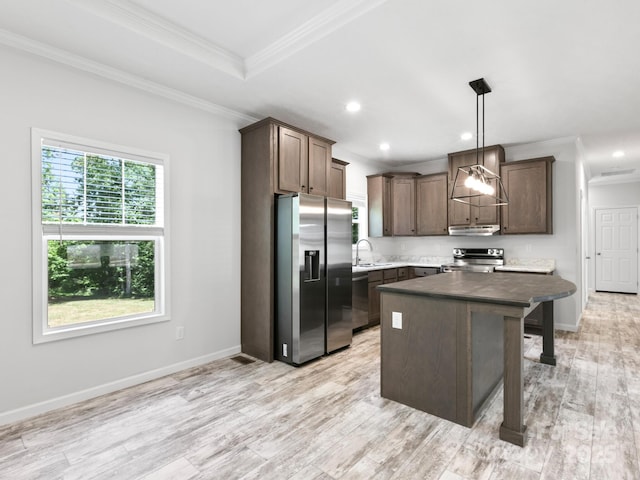 208 Walnut Branch Rd, Weaverville, NC 28787 - kitchen with appliances with stainless steel finishes, under cabinet range hood, crown molding, a kitchen island, and light wood finished floors