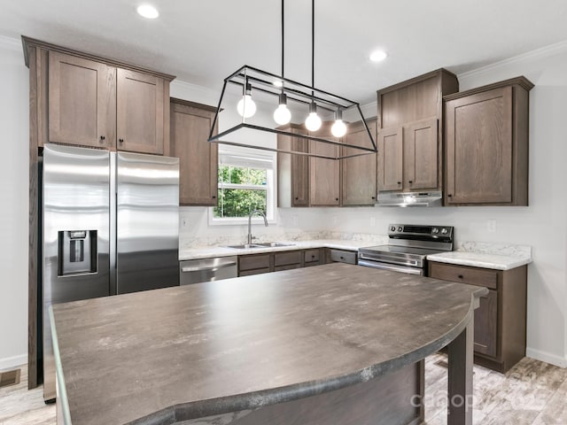 208 Walnut Branch Rd, Weaverville, NC 28787 - kitchen with stainless steel appliances, under cabinet range hood, ornamental molding, recessed lighting, and dark brown cabinetry
