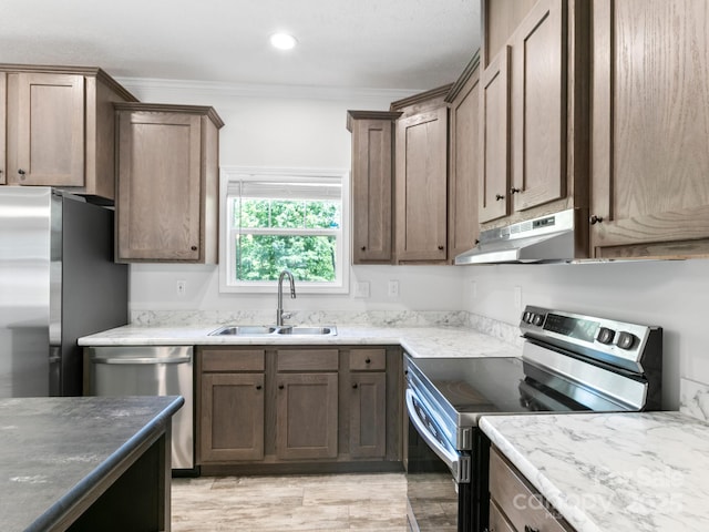 208 Walnut Branch Rd, Weaverville, NC 28787 - kitchen featuring stainless steel appliances, under cabinet range hood, ornamental molding, light wood-type flooring, and recessed lighting