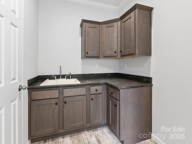 208 Walnut Branch Rd, Weaverville, NC 28787 - kitchen with dark countertops, ornamental molding, and light wood finished floors