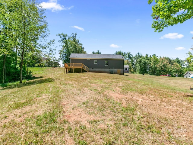 208 Walnut Branch Rd, Weaverville, NC 28787 - rear view of house with a wooden deck, stairs, and a lawn