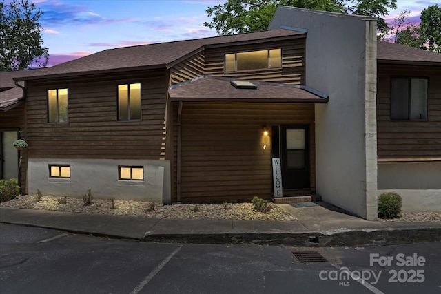 1420 11th Street Dr NW Unit 15, Hickory, NC 28601 - view of front facade with a shingled roof and uncovered parking