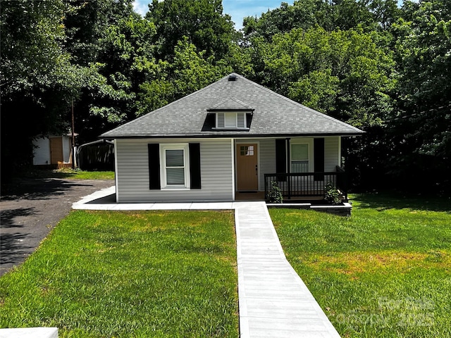 305 E Henry St, Belmont, NC 28012 - bungalow-style house with covered porch, roof with shingles, and a front yard