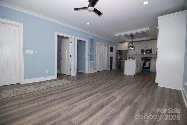 305 E Henry St, Belmont, NC 28012 - unfurnished living room featuring a ceiling fan, crown molding, recessed lighting, and dark wood-type flooring