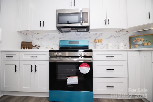 305 E Henry St, Belmont, NC 28012 - kitchen featuring stainless steel appliances, white cabinetry, backsplash, and light countertops
