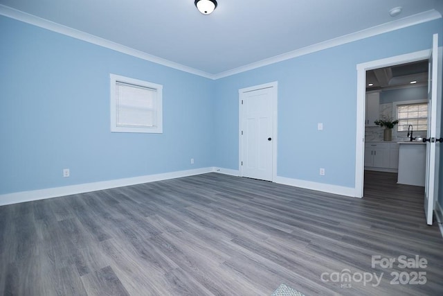 305 E Henry St, Belmont, NC 28012 - unfurnished room with ornamental molding, dark wood-type flooring, and a smoke detector