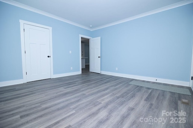 305 E Henry St, Belmont, NC 28012 - unfurnished room with wood finished floors and crown molding
