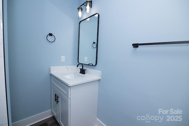 305 E Henry St, Belmont, NC 28012 - bathroom featuring vanity and baseboards