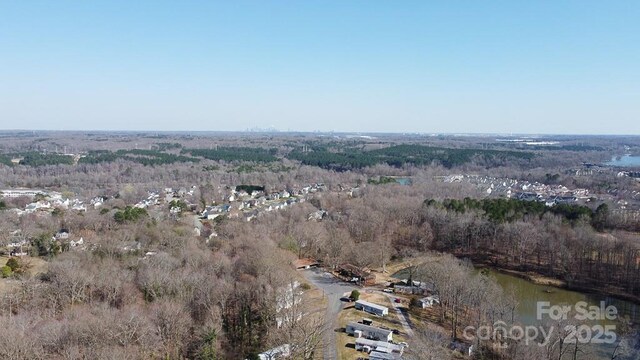 305 E Henry St, Belmont, NC 28012 - aerial view of property's location with a forest and a large body of water
