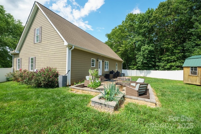 206 Taylor Cir, Granite Falls, NC 28630 - rear view of property with an outdoor living space, a storage shed, a fenced backyard, a patio, and roof with shingles