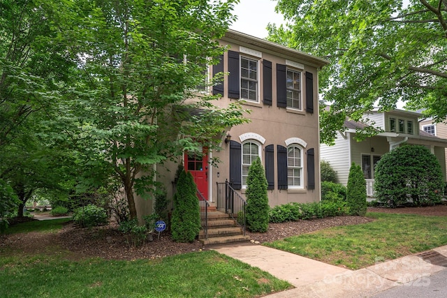 115 White Ash Dr Unit E, Asheville, NC 28801 - view of front facade featuring stucco siding and a front lawn