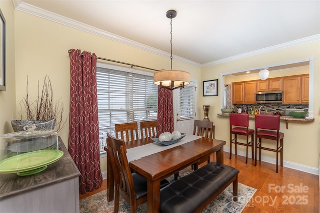 115 White Ash Dr Unit E, Asheville, NC 28801 - dining area featuring crown molding and light wood-style flooring