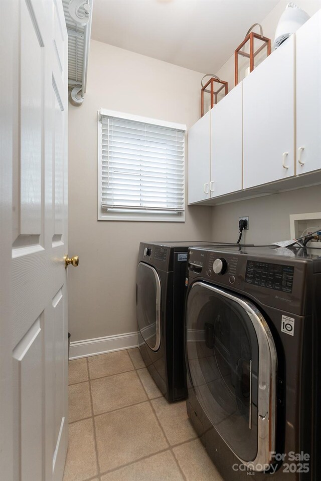 115 White Ash Dr Unit E, Asheville, NC 28801 - laundry area featuring cabinet space, independent washer and dryer, and light tile patterned flooring