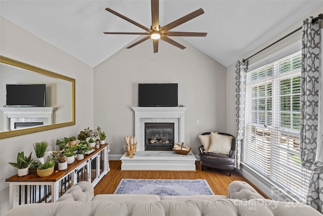3020 Waxhaw Crossing Dr, Waxhaw, NC 28173 - living area featuring a premium fireplace, ceiling fan, wood finished floors, and vaulted ceiling