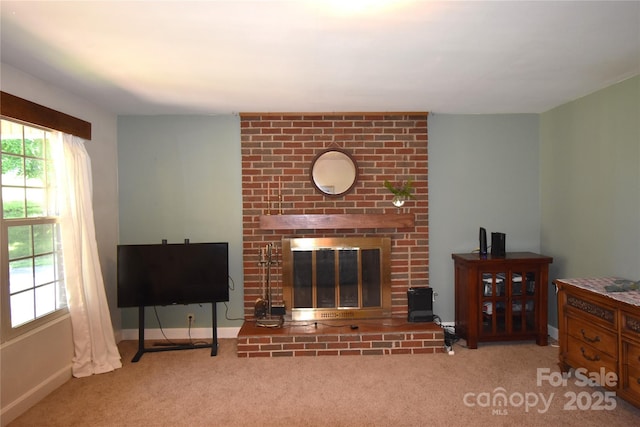 141 Azalea Dr, Connelly Springs, NC 28612 - carpeted living area featuring a brick fireplace and baseboards