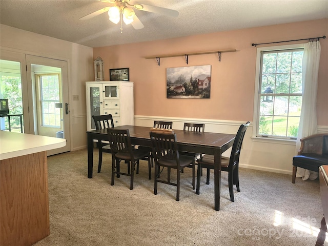 141 Azalea Dr, Connelly Springs, NC 28612 - dining area with light colored carpet, ceiling fan, and a textured ceiling