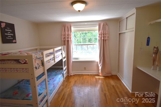 141 Azalea Dr, Connelly Springs, NC 28612 - bedroom featuring light wood-style flooring and baseboards