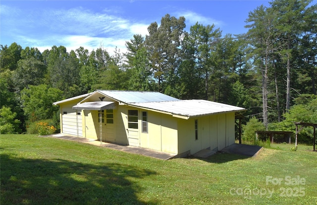 141 Azalea Dr, Connelly Springs, NC 28612 - view of outdoor structure featuring a view of trees