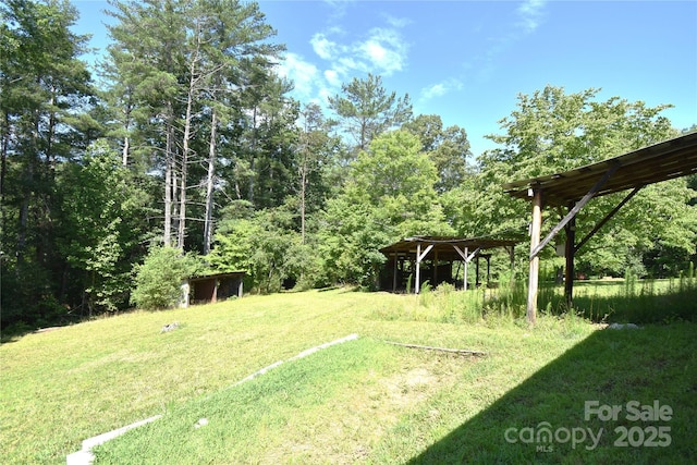 141 Azalea Dr, Connelly Springs, NC 28612 - view of grassy yard with a wooded view