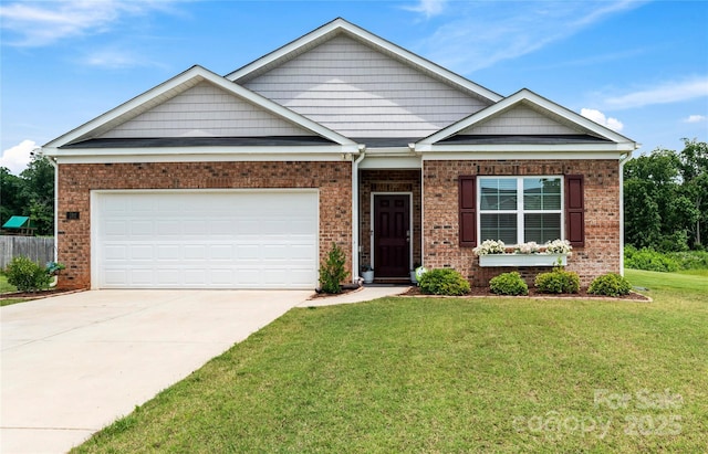 192 Culloden Dr, Mocksville, NC 27028 - view of front of house with a front yard, concrete driveway, brick siding, and a garage