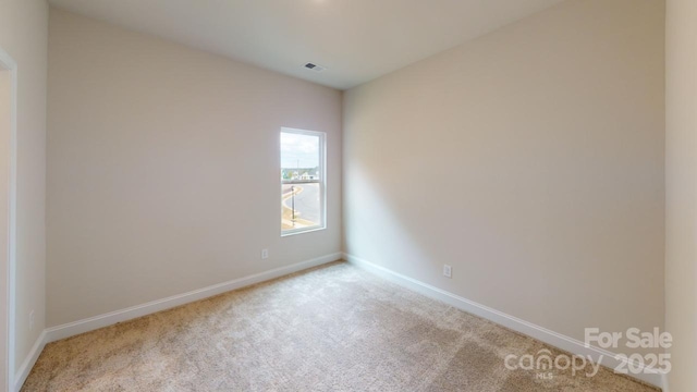 608 Banter Ln Unit 31, Cramerton, NC 28032 - carpeted spare room featuring baseboards
