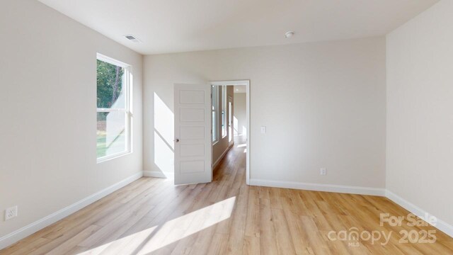 608 Banter Ln Unit 31, Cramerton, NC 28032 - spare room with light wood-style floors and baseboards