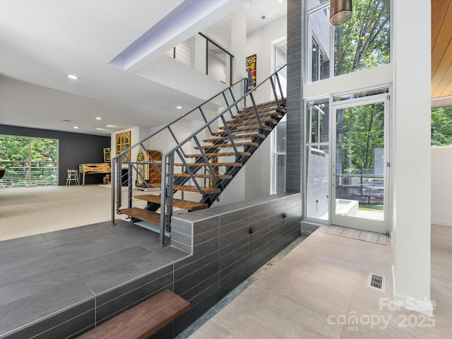 3306 Nancy Creek Rd, Charlotte, NC 28270 - stairway with recessed lighting, a high ceiling, and tile patterned flooring