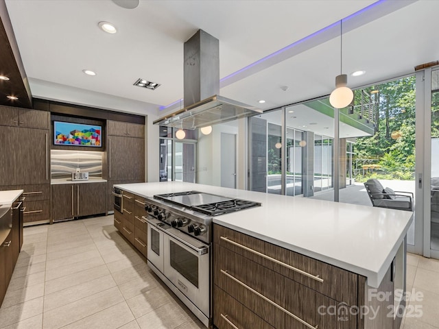 3306 Nancy Creek Rd, Charlotte, NC 28270 - kitchen featuring double oven range, light tile patterned floors, modern cabinets, dark brown cabinetry, and light countertops