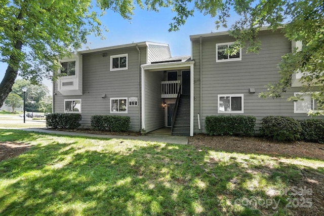 3020 Heathstead Pl Unit A, Charlotte, NC 28210 - rear view of house featuring stairway and a lawn
