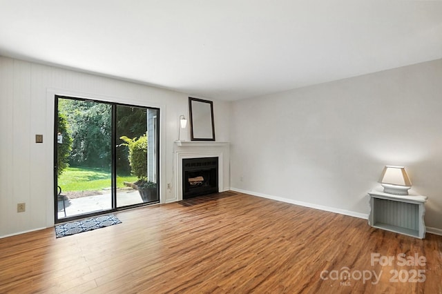 3020 Heathstead Pl Unit A, Charlotte, NC 28210 - unfurnished living room with wood finished floors and a fireplace with flush hearth