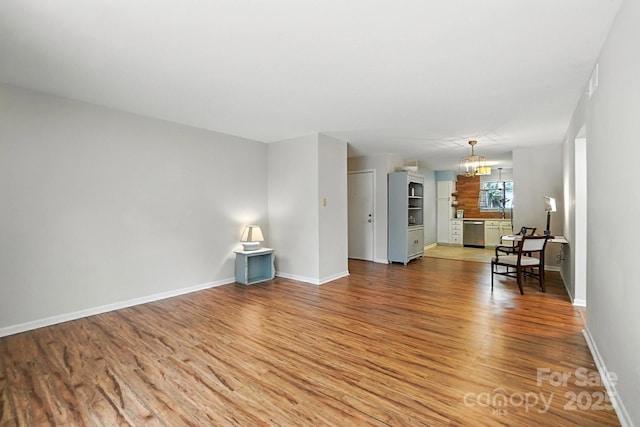 3020 Heathstead Pl Unit A, Charlotte, NC 28210 - living area with light wood-style flooring and a chandelier