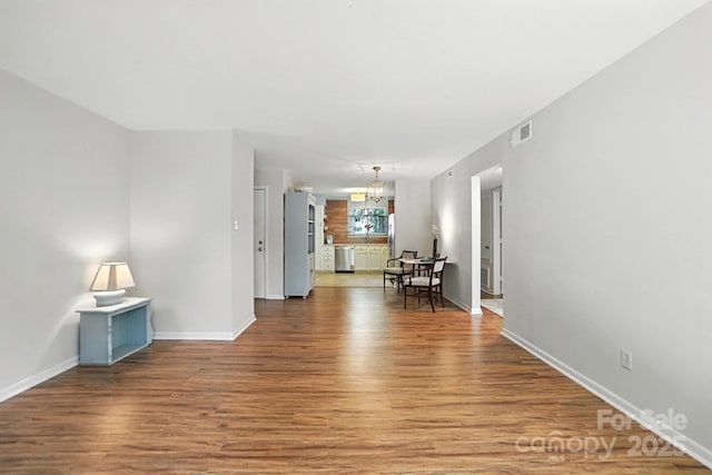 3020 Heathstead Pl Unit A, Charlotte, NC 28210 - spare room featuring a chandelier and wood finished floors