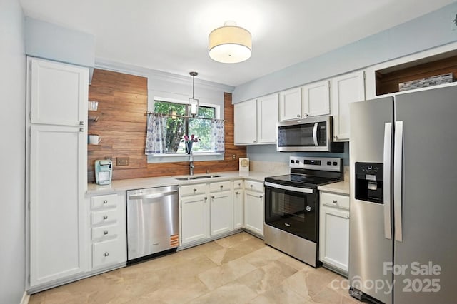 3020 Heathstead Pl Unit A, Charlotte, NC 28210 - kitchen featuring stainless steel appliances, light countertops, white cabinets, and pendant lighting