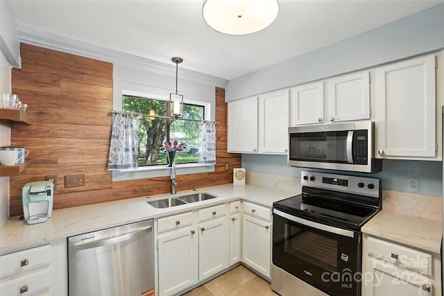 3020 Heathstead Pl Unit A, Charlotte, NC 28210 - kitchen with stainless steel appliances, white cabinetry, light stone countertops, and hanging light fixtures