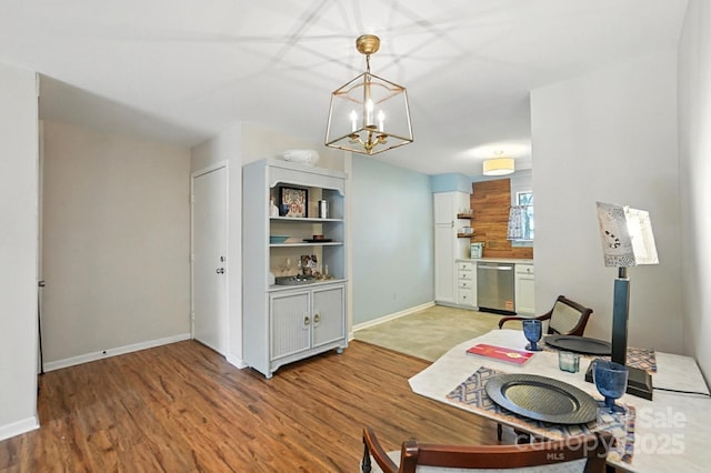 3020 Heathstead Pl Unit A, Charlotte, NC 28210 - home office featuring light wood-style flooring and a chandelier