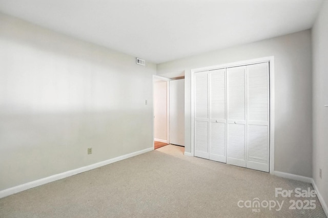 3020 Heathstead Pl Unit A, Charlotte, NC 28210 - unfurnished bedroom with light colored carpet and a closet