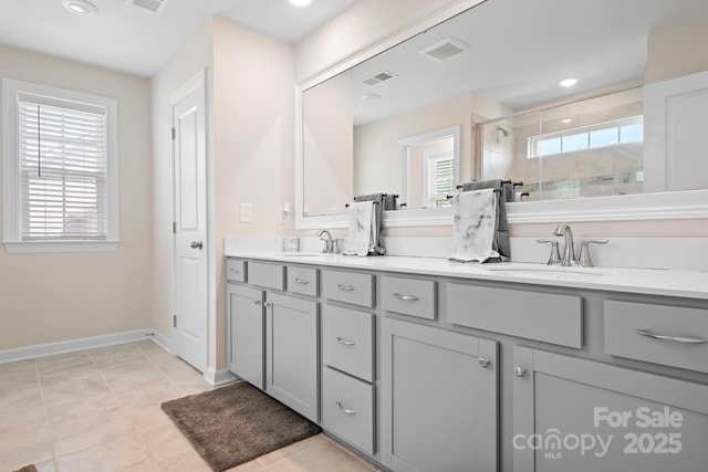 4116 Tory Path Rd, Waxhaw, NC 28173 - full bath featuring double vanity, a shower stall, recessed lighting, and tile patterned flooring