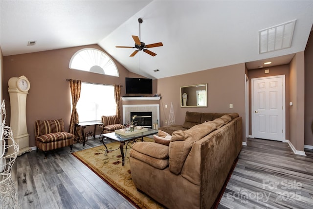 6811 Ledgestone Pl, Charlotte, NC 28227 - living area featuring ceiling fan, lofted ceiling, a fireplace, and wood finished floors