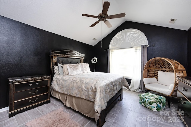 6811 Ledgestone Pl, Charlotte, NC 28227 - bedroom with lofted ceiling, a ceiling fan, and a textured wall
