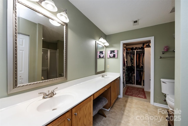 6811 Ledgestone Pl, Charlotte, NC 28227 - full bath with double vanity, a stall shower, tile patterned flooring, and a spacious closet