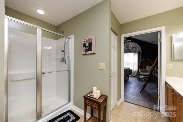 6811 Ledgestone Pl, Charlotte, NC 28227 - ensuite bathroom with vanity, a shower stall, and tile patterned floors