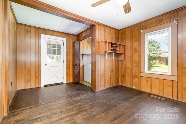 3425 Long Ferry Rd, Salisbury, NC 28146 - spare room with washer / clothes dryer, dark wood finished floors, wood walls, and ceiling fan