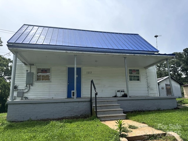 127 Hill St, Mooresboro, NC 28114 - bungalow with a standing seam roof, covered porch, and a metal roof