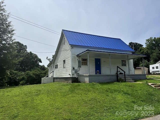127 Hill St, Mooresboro, NC 28114 - bungalow-style house with covered porch, a front lawn, and a metal roof